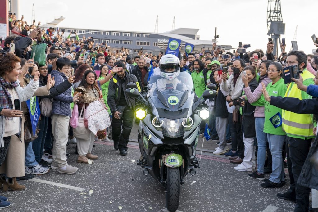 Spiritual leader Sadhguru rides a motorcycle through a crowd of cheering fans as he sets off on a 100-day journey to raise awareness about soil depletion. 