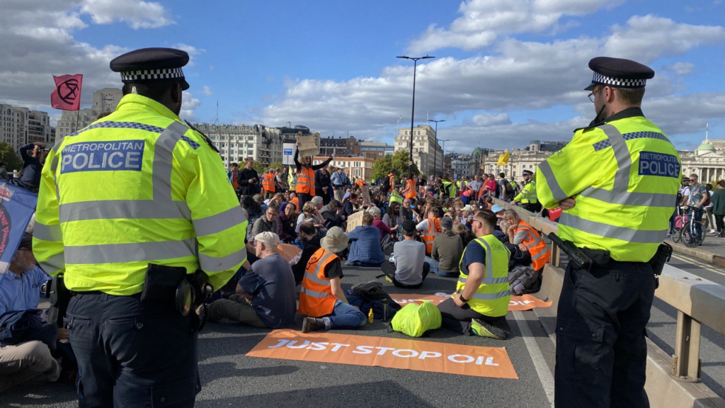Hundreds of climate activists with Just Stop Oil blockade a bridge in London.