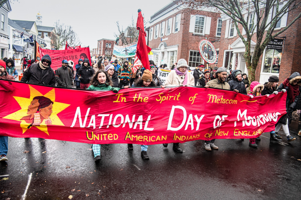 Indigenous Peoples and allies march in Plymouth, MA, on the National Day of Mourning that coincides with US Thanksgiving Day.