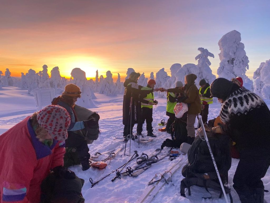 Amidst a glowing sunset and snow-covered trees, Finnish activists strap on x-country skis to start their trek to blockade a state logging site.