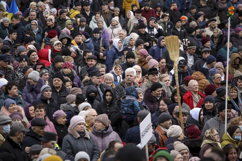 A large crowd of Moldovans rally in the state capital to oppose the cost of living crisis.